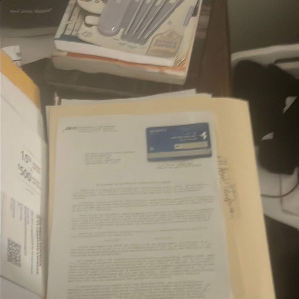 Blue Credit Card on Document Papers